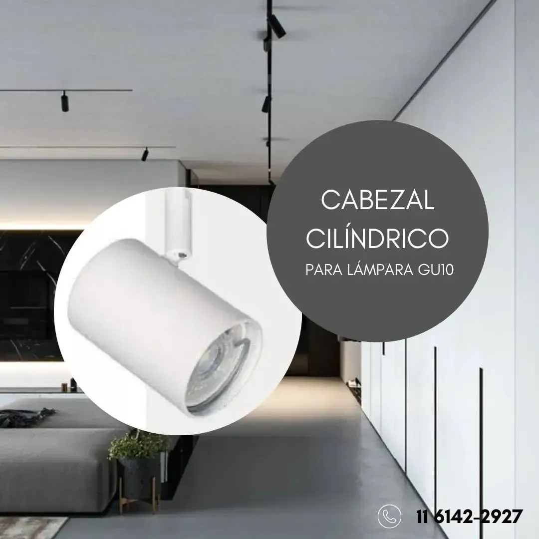 Cabezal de luminaria cilíndrico blanco sobre carril, con superposición de texto: 