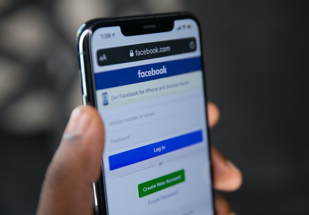 phone screen with facebook as an automotive marketing strategy to use