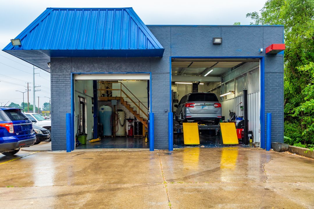 A car is being worked on in a garage.