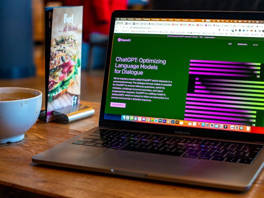 A laptop computer is sitting on a table with ChatGPT opened.