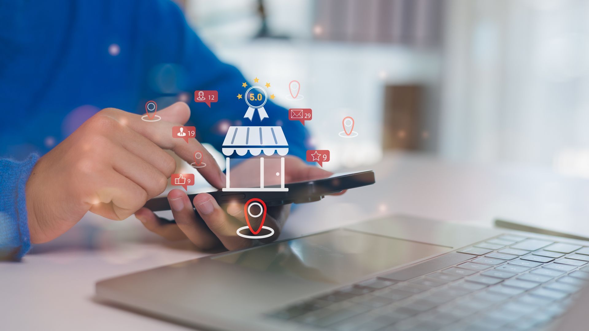 Person using smartphone with digital marketing icons representing local business visibility