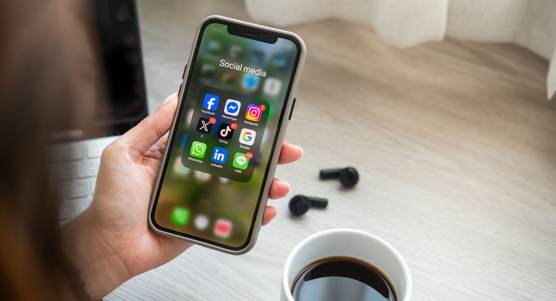 person holding a phone and looking at instagram and other social media apps