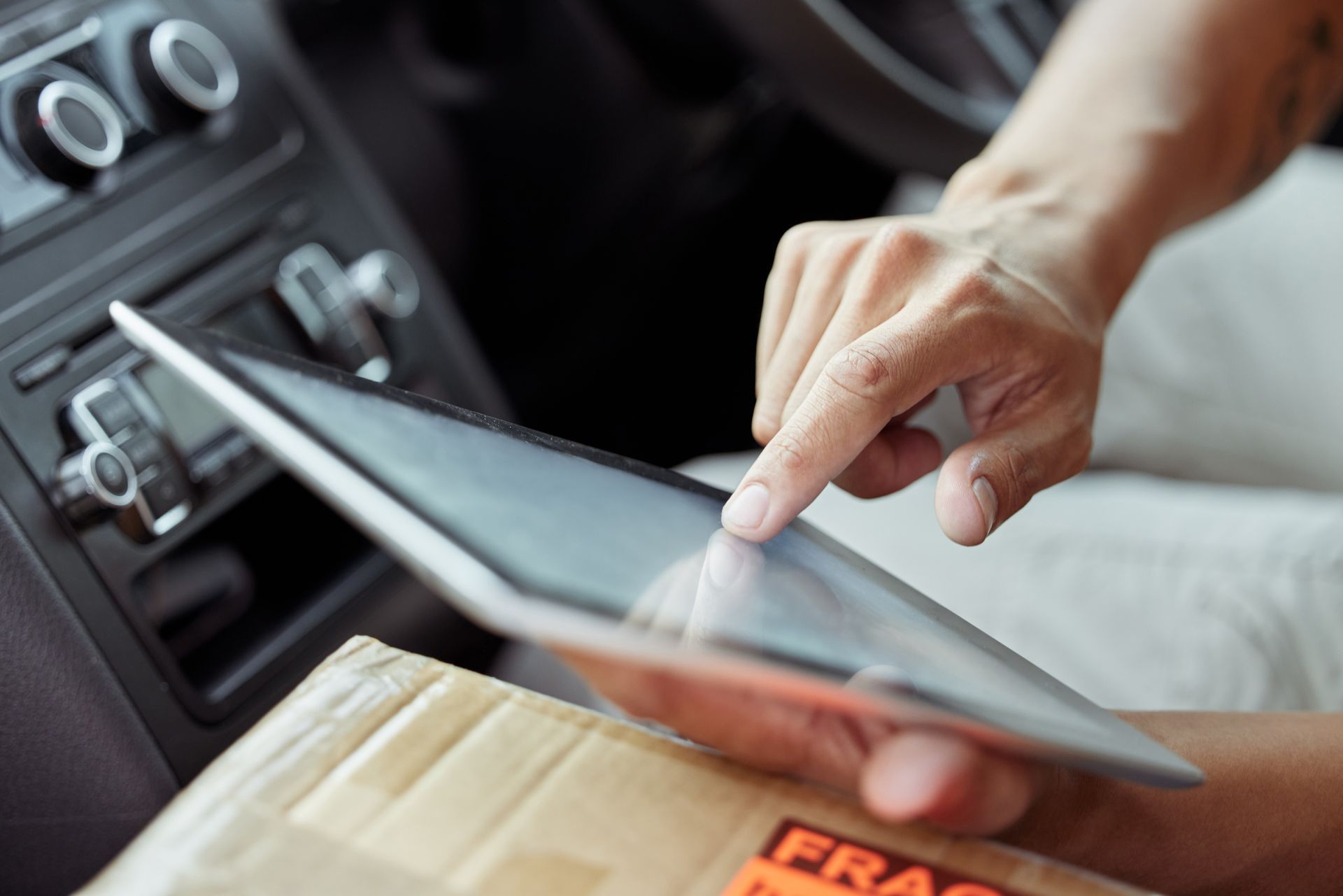 Customer using an iPad to find a local auto repair shop through online directory listings