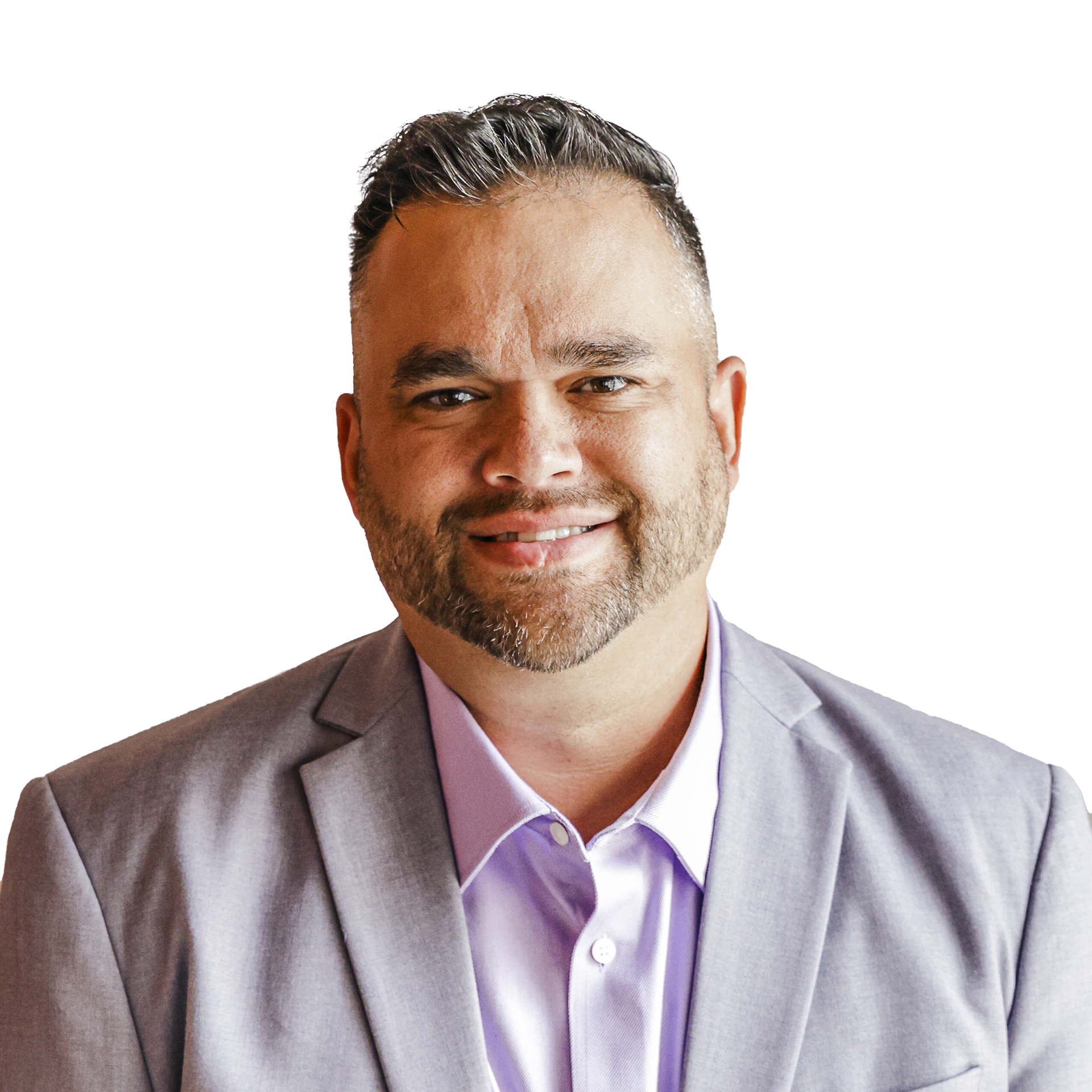 A man with a beard is wearing a gray suit and a purple shirt.