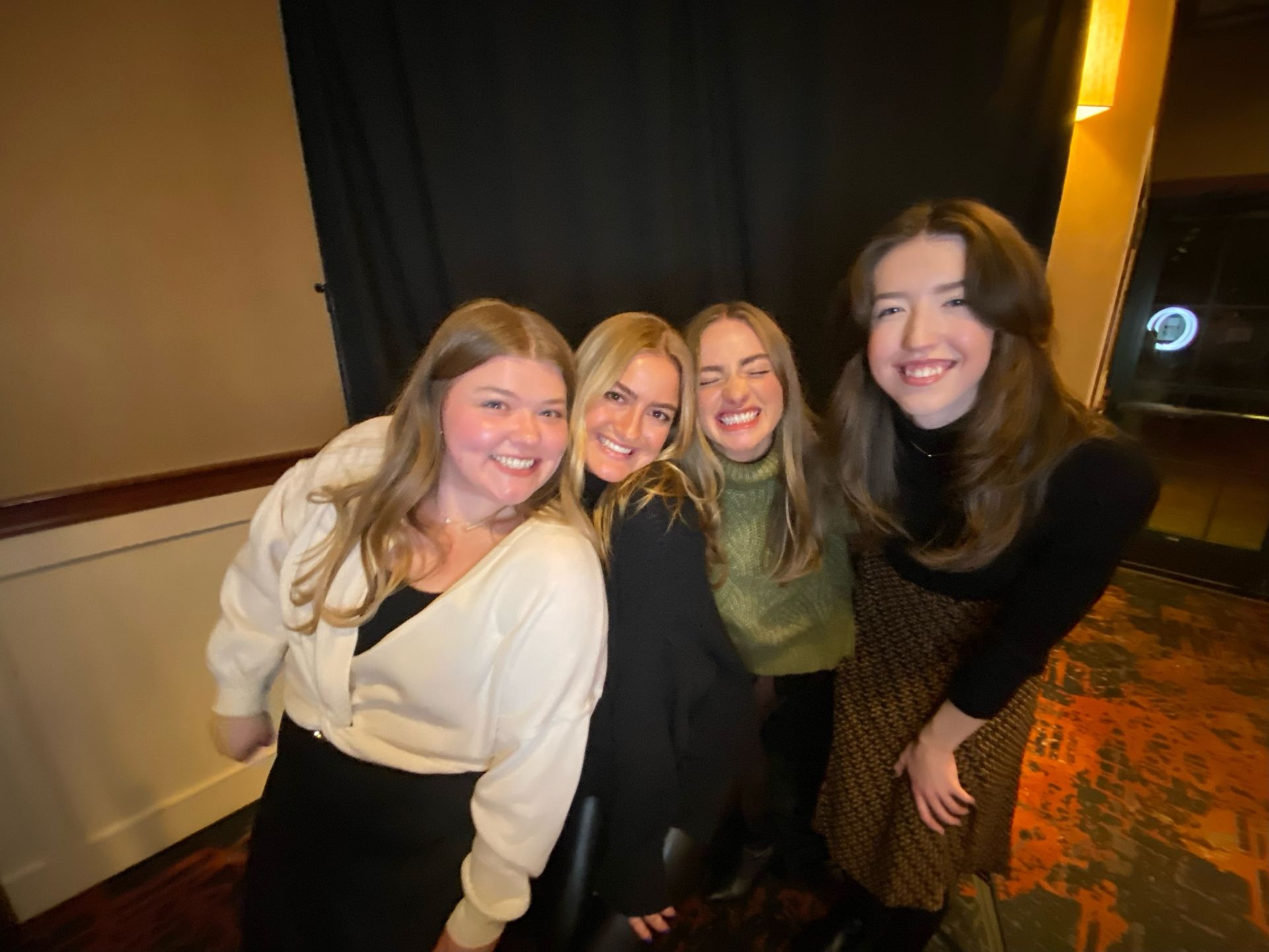 A group of young women are posing for a picture together.