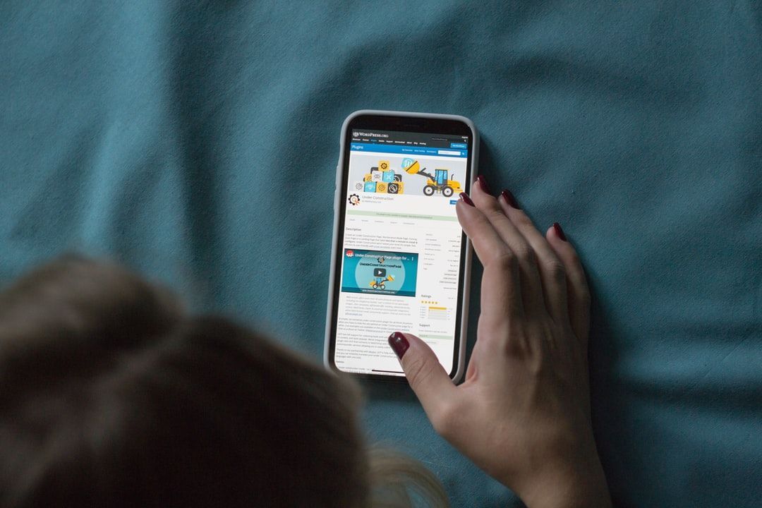 Person browsing a mobile-friendly website on a smartphone f