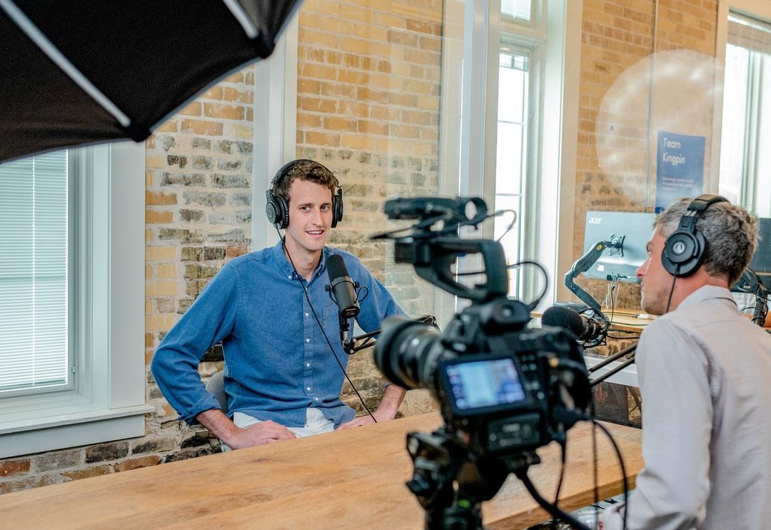 Two men recording a podcast as part of content marketing for small businesses