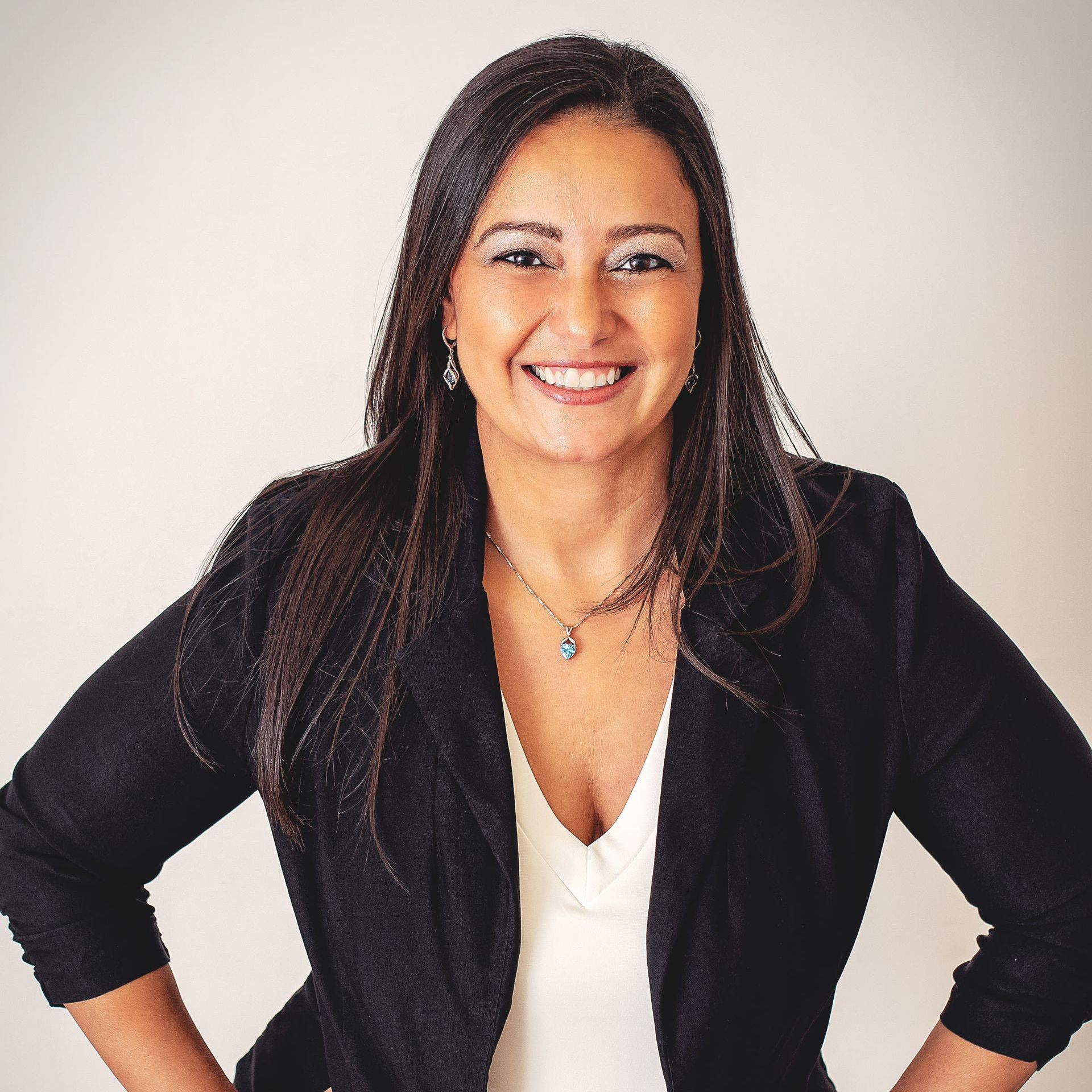 Sylvia Tadros looking at the camera and smiling.