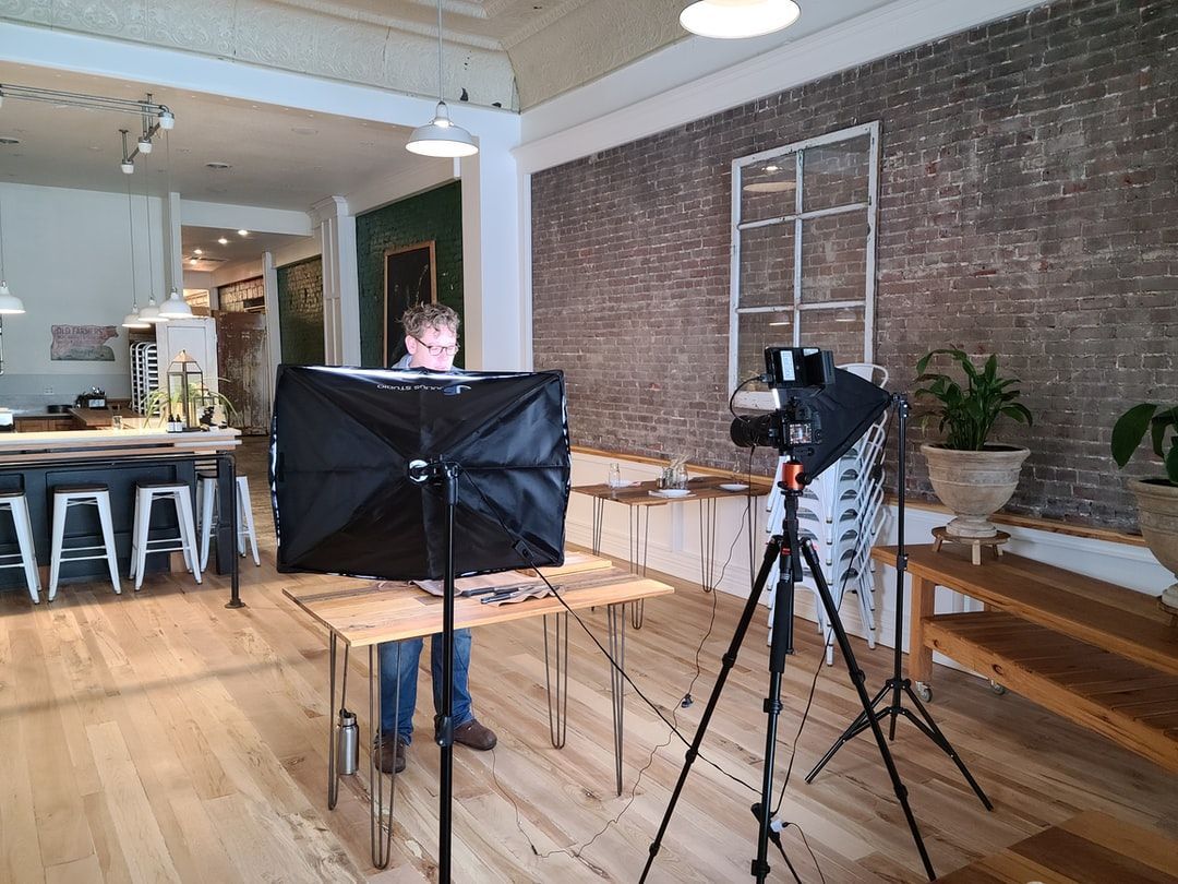 A person setting up a product shoot as part of an affiliate marketing campaign