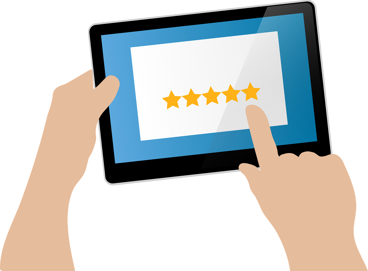 A person is holding a tablet with a five stars review on it during his customer journey.