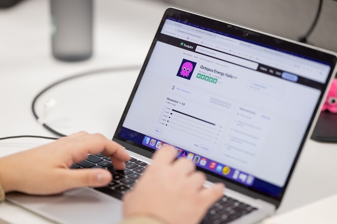 Person reading customer feedback on a laptop showing why are reviews important for business trust.