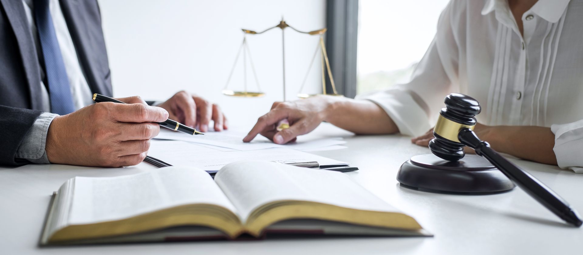 Man & Woman going over solicitor papers 