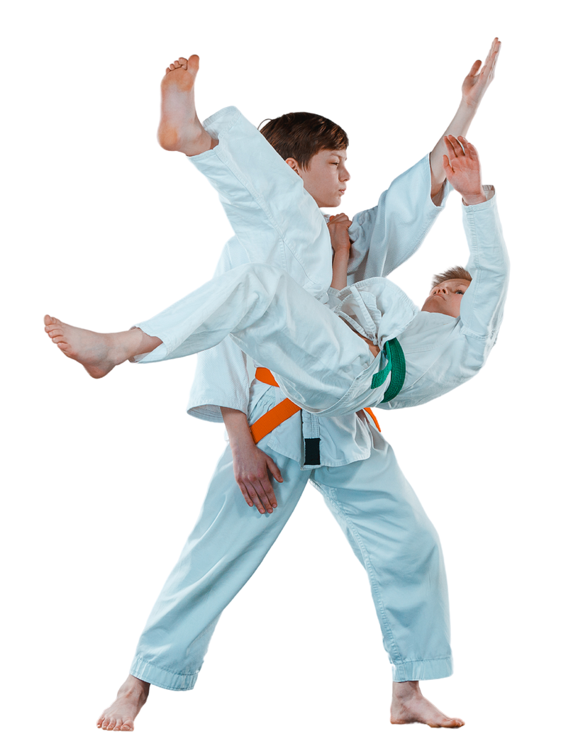 A boy and a girl are practicing karate with black belts