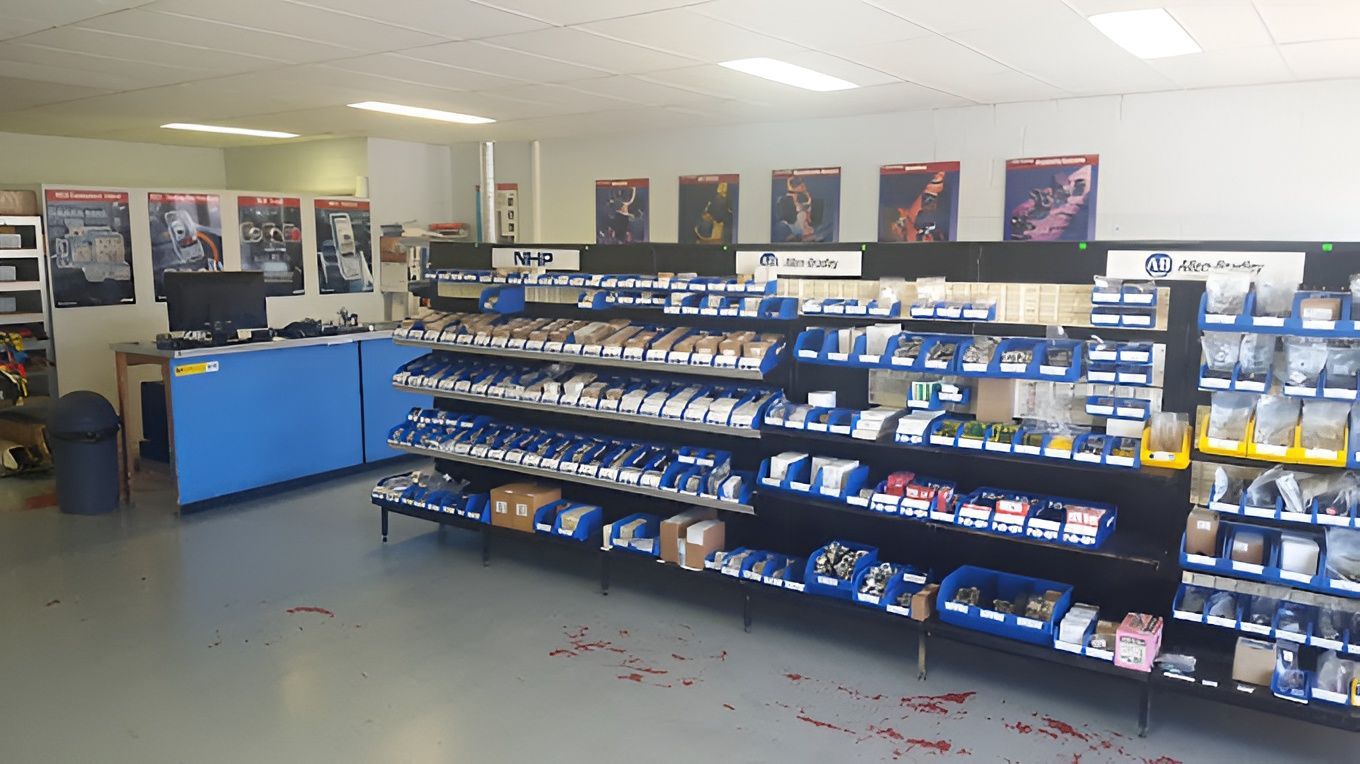 A Store With a Lot of Shelves and a Blue Counter — Switchboard & Power Controls Pty Ltd in Alice Springs, NT