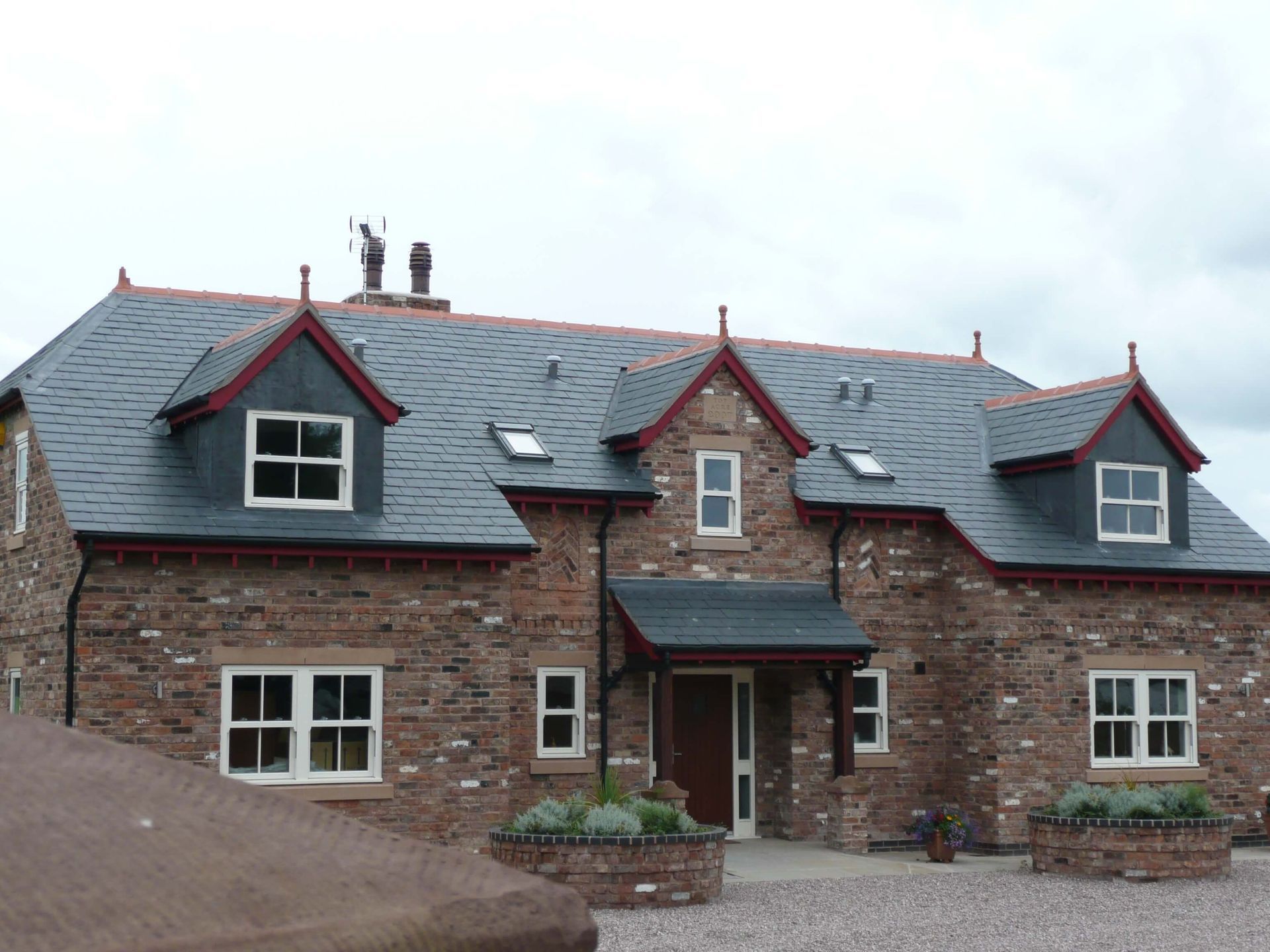 A large brick house with a slate roof