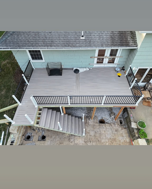 The back of a house with a deck and stairs