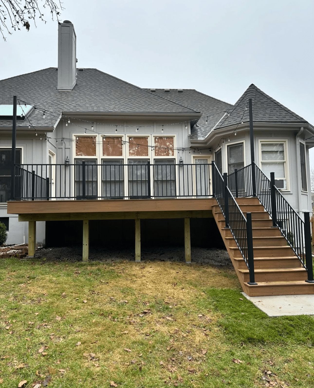 The back of a house with a deck and stairs