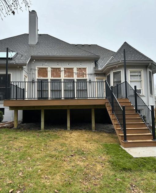 The back of a house with a deck and stairs