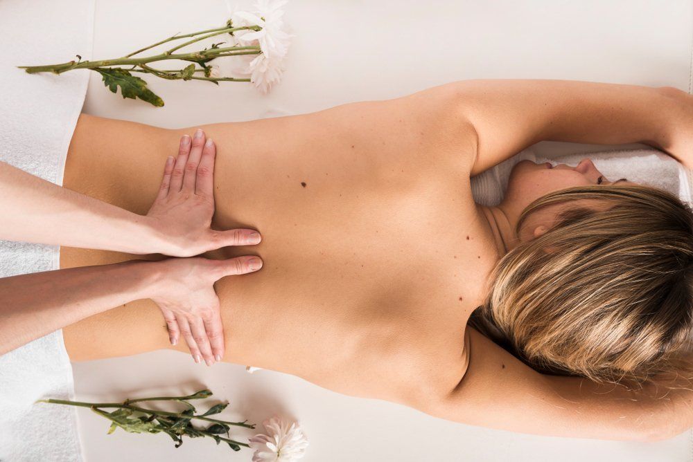 Woman Getting Relaxing Back Massage — VR Mobile Beauty Therapy In Oxenford QLD