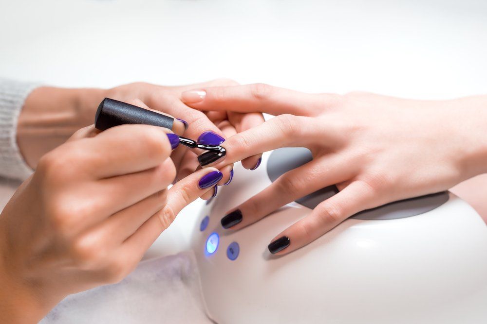Manicurist Applies Nail Gel Polish — VR Mobile Beauty Therapy In Oxenford QLD