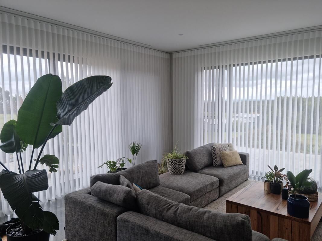 Lounge room with couch and window coverings - Luxaflex Soft Shades In Ballarat