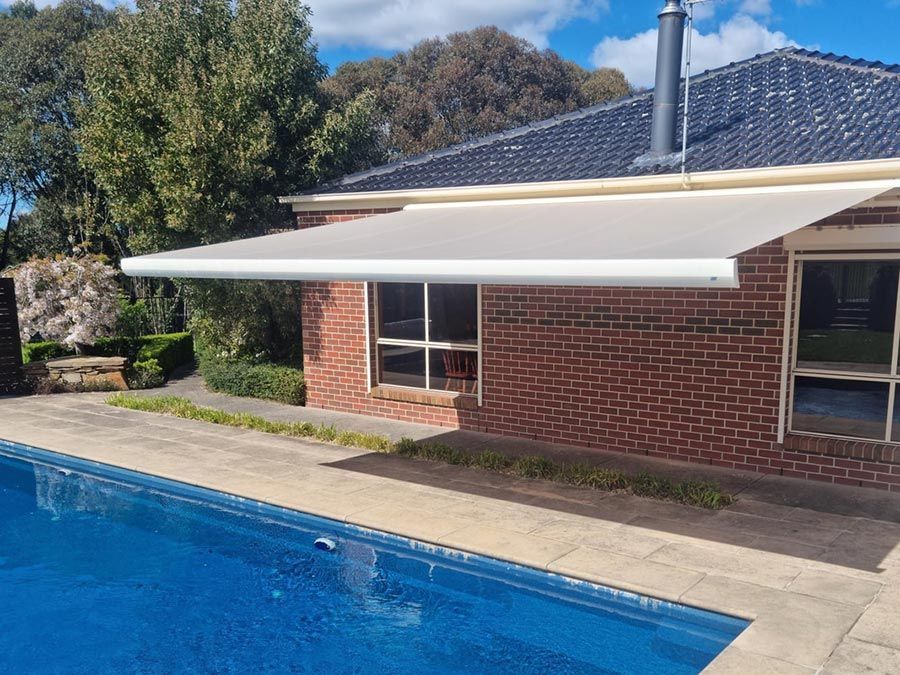 Folding Arm Awnings by the Poolside - Luxaflex Outdoor Blinds & Awnings In Ballarat
