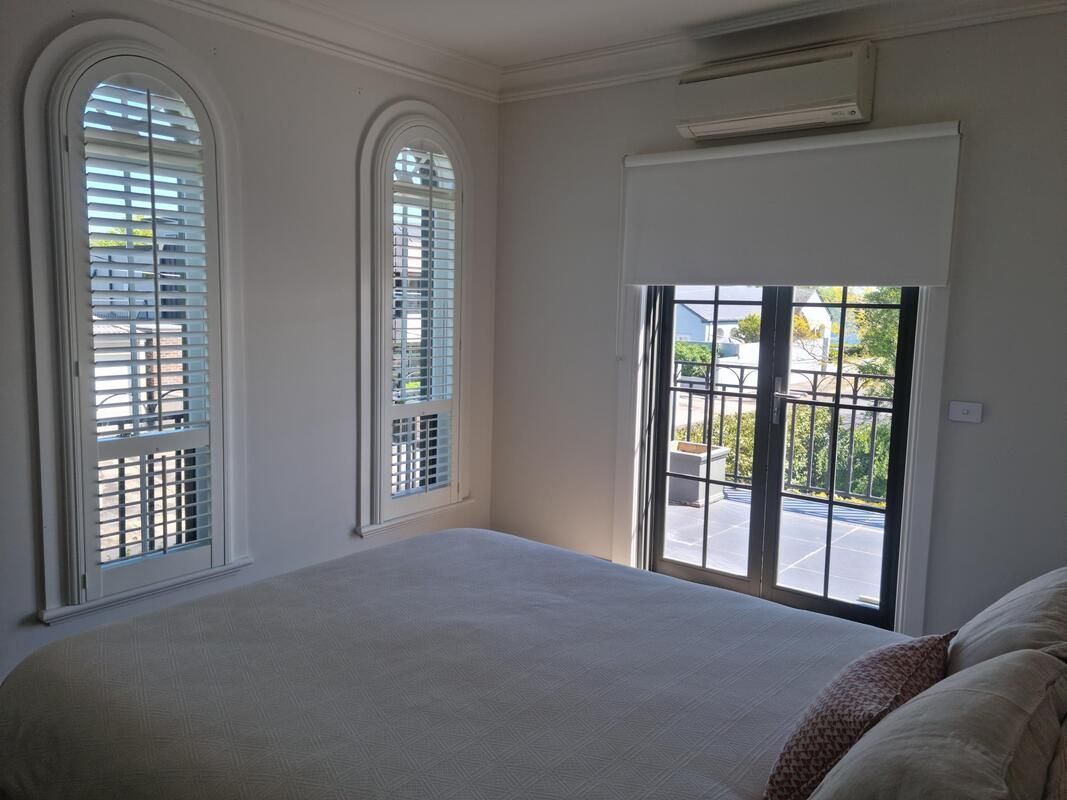 Chic Interior with PolySatin Shutters and Seating - Luxaflex Plantation Shutters In Ballarat
