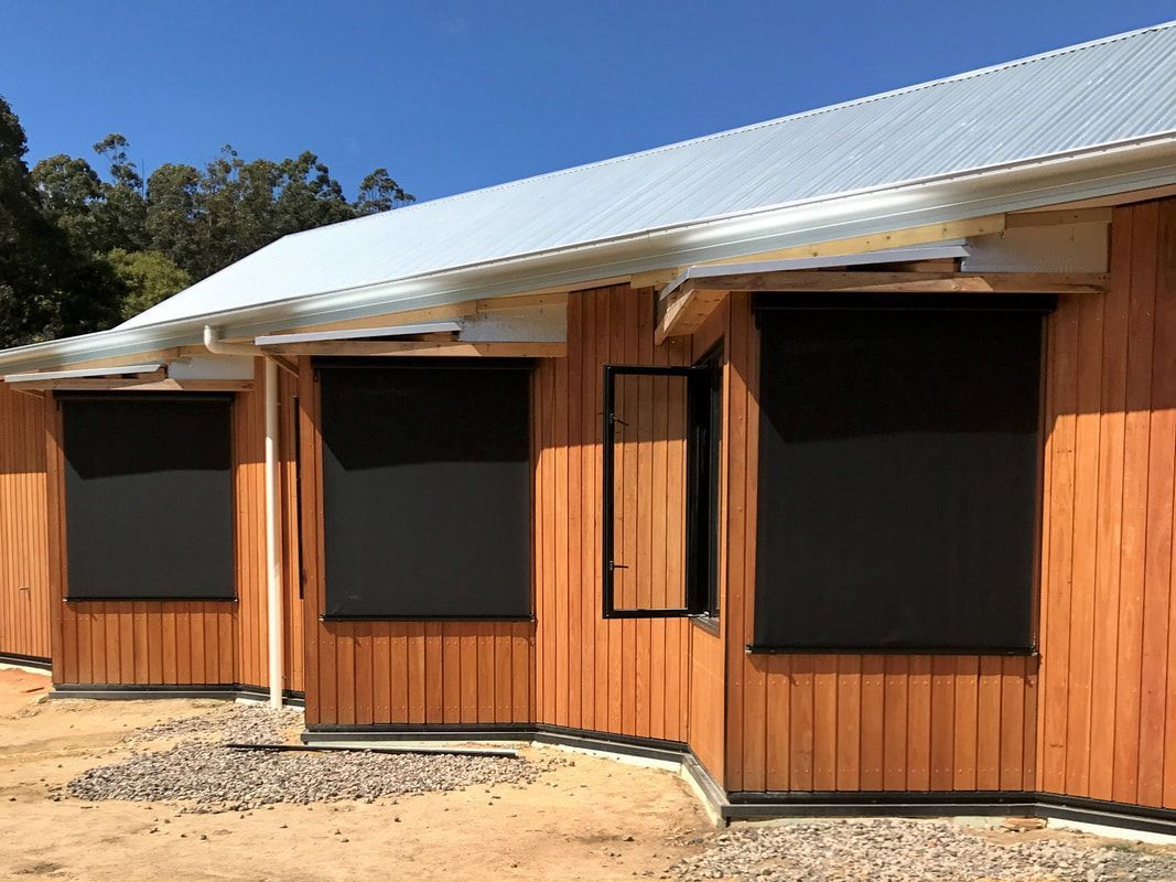 Glass Door with Fixed Guide Awnings Showcasing Stylish Outdoor Architecture and Design - Luxaflex Outdoor Blinds & Awnings In Ballarat