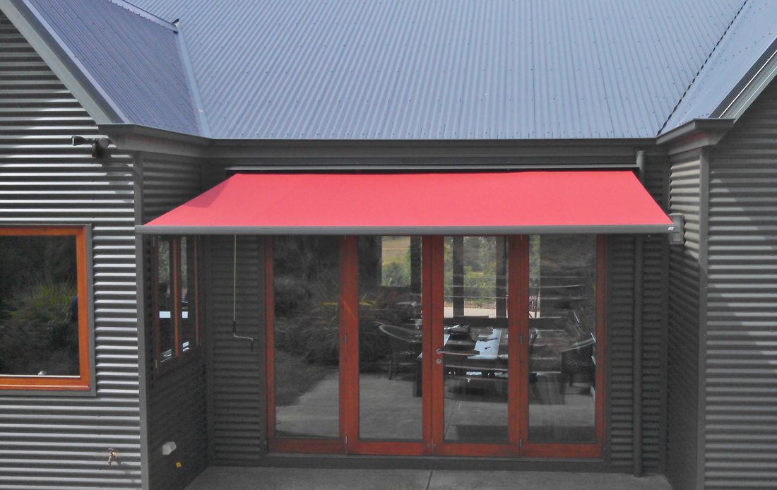 Gallery showcasing Red Folding Arm Awnings at Eureka Blinds & Curtains  - Luxaflex Outdoor Blinds & Awnings In Ballarat