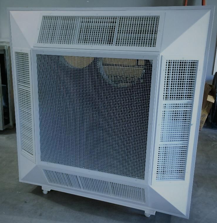 A white air conditioner with a mesh screen on top of it