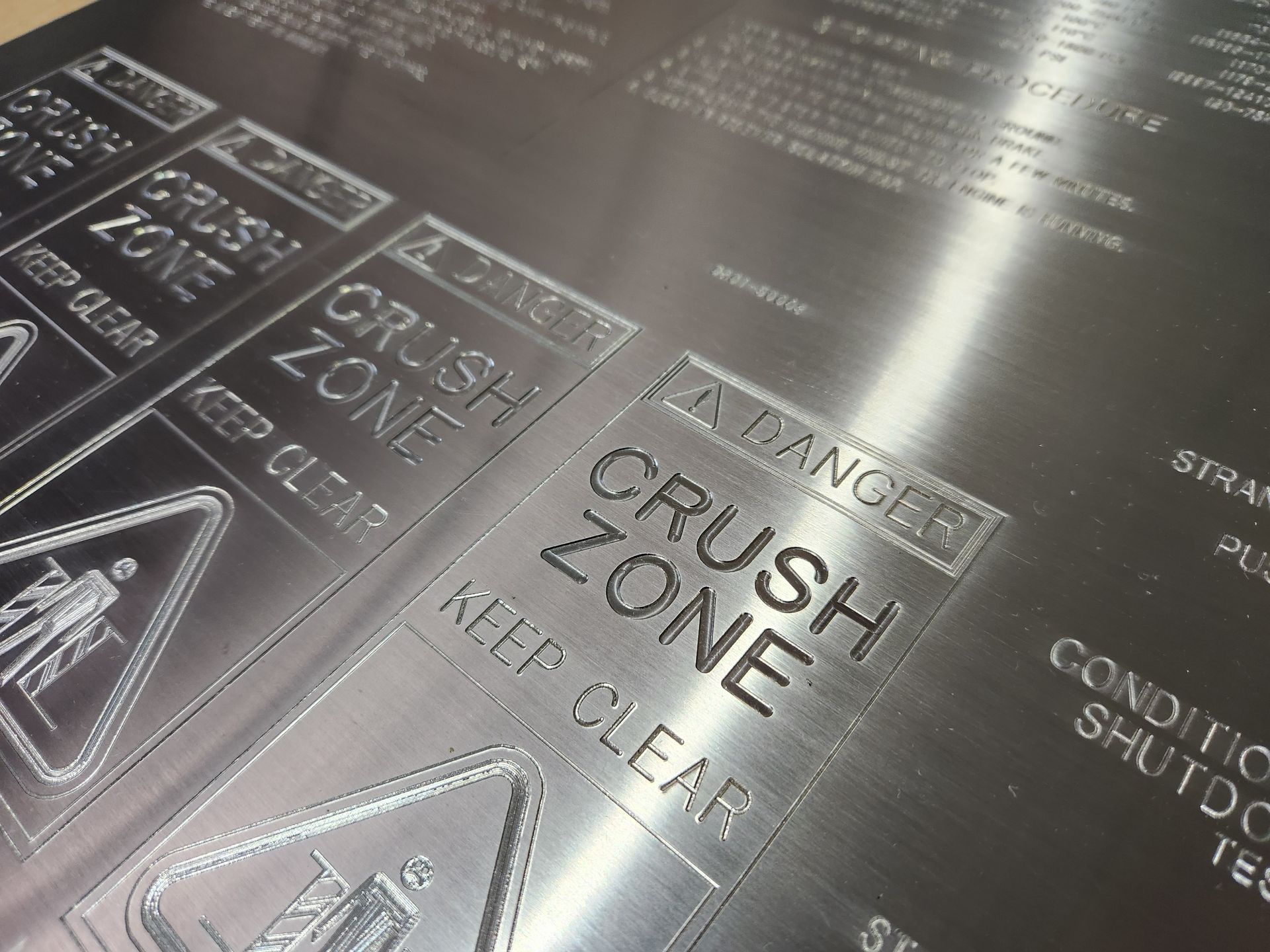 A close-up of silver metal which has been engraved— Total Engraving In Sandgate, NSW