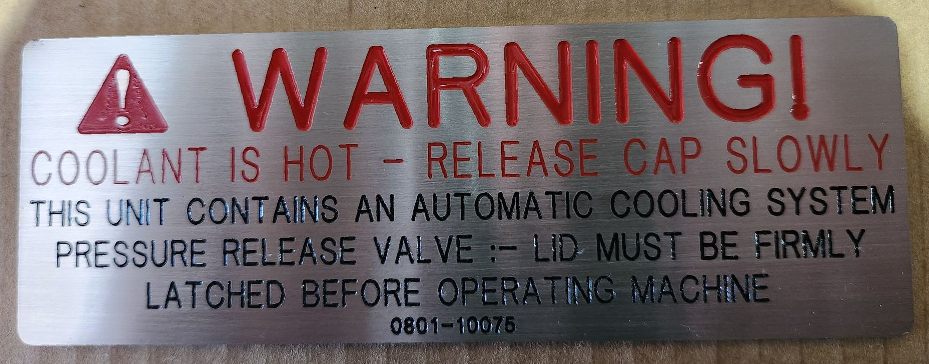 A warning sign has been engraved and coloured in Red — Total Engraving In Sandgate, NSW