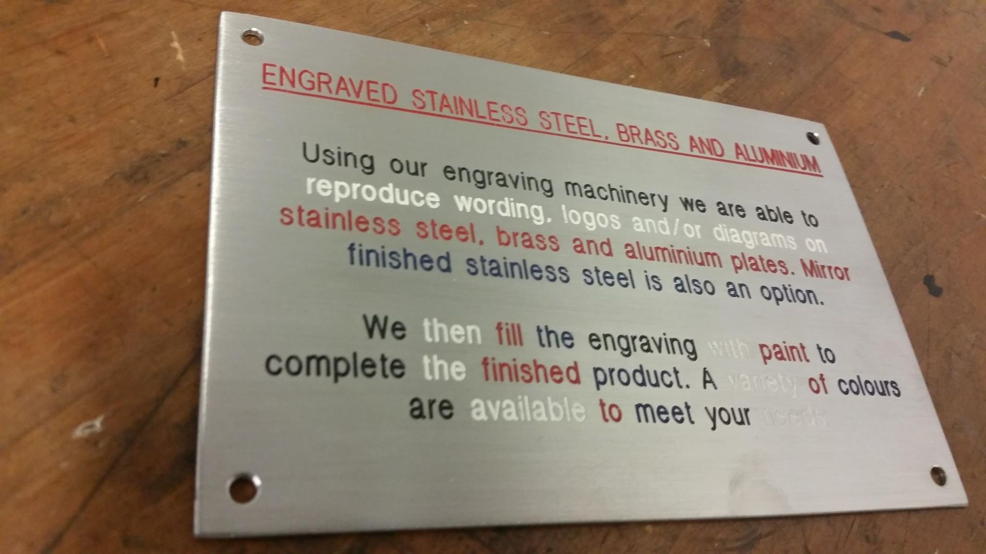 A Sign That Says Engraved Stainless Steel on It — Total Engraving In Sandgate, NSW