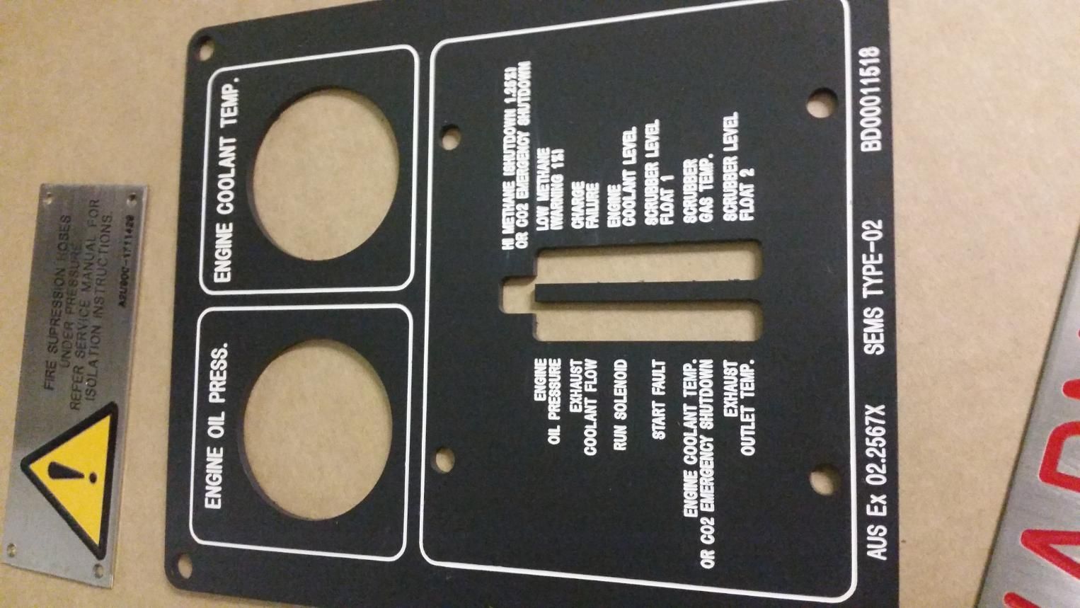 A Black and White Plaque That Says Engine Oil Press — Total Engraving In Sandgate, NSW