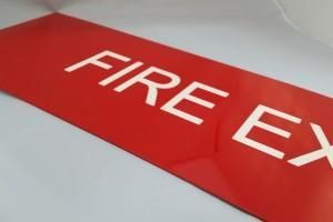 A Red Sign That Says Fire Ex on It — Total Engraving In Sandgate, NSW