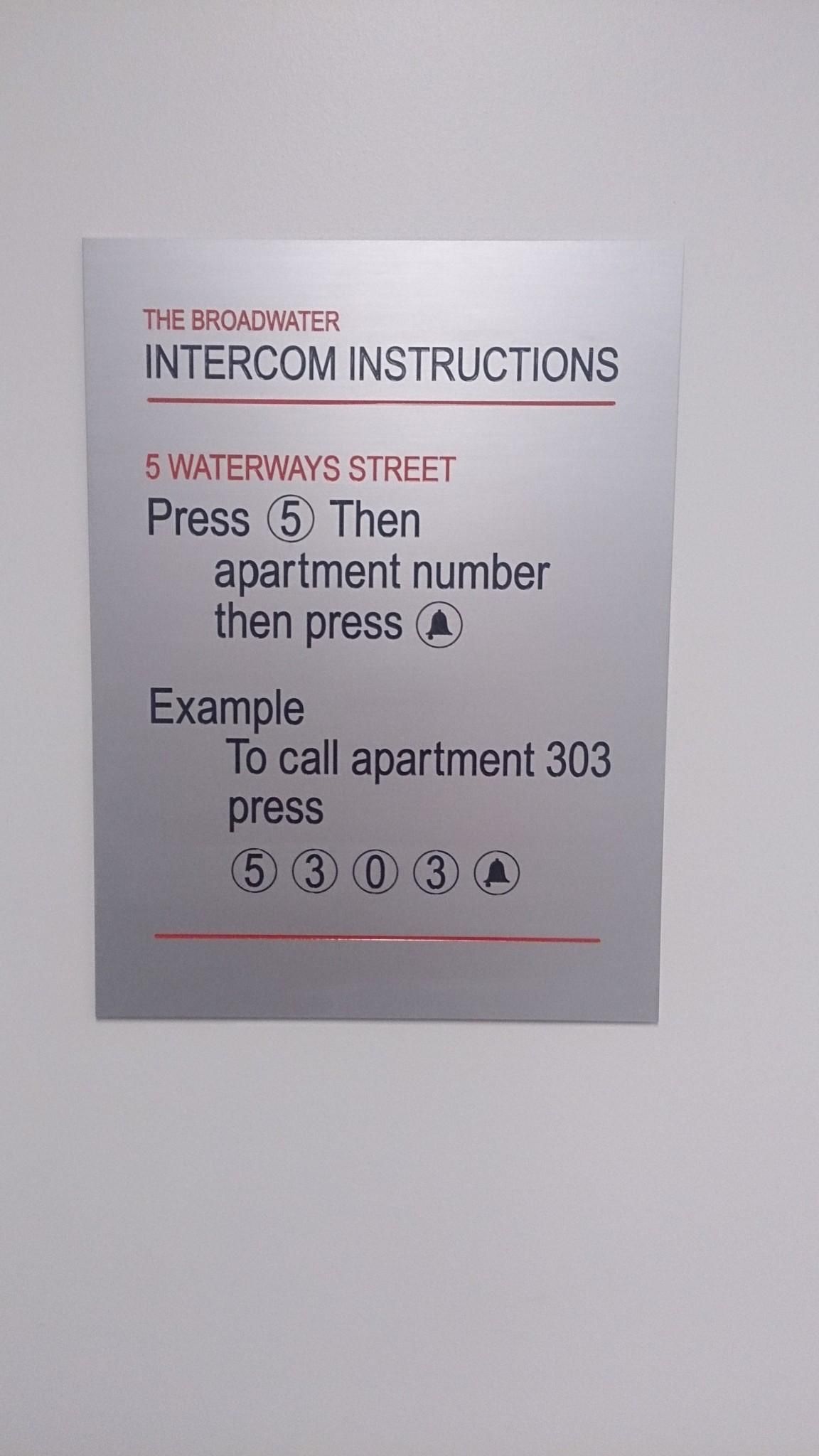 A Sign on a Wall That Says Intercom Instructions — Total Engraving In Sandgate, NSW
