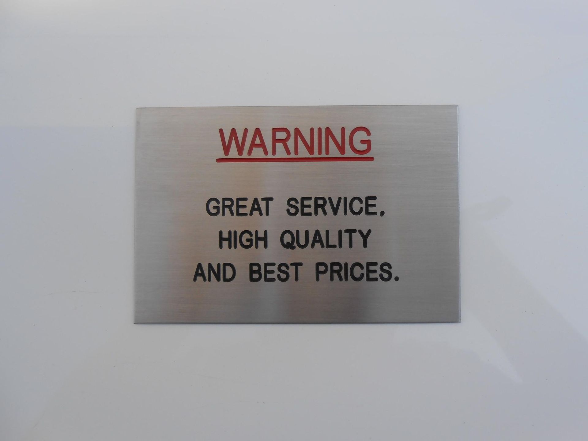 A warning symbol has been engraved — Total Engraving In Sandgate, NSW