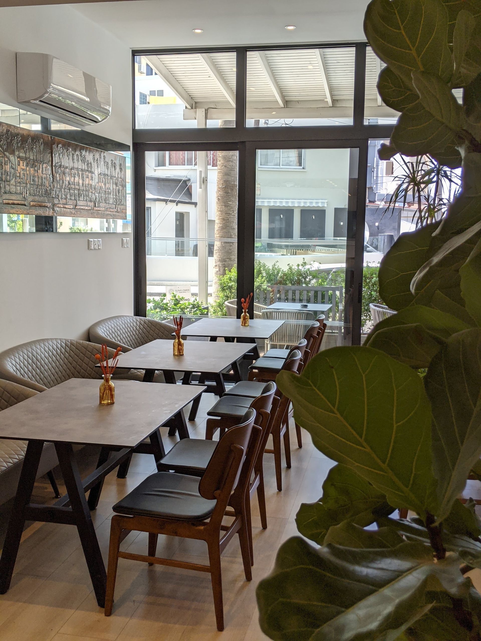 A chair and a table on a balcony overlooking a city