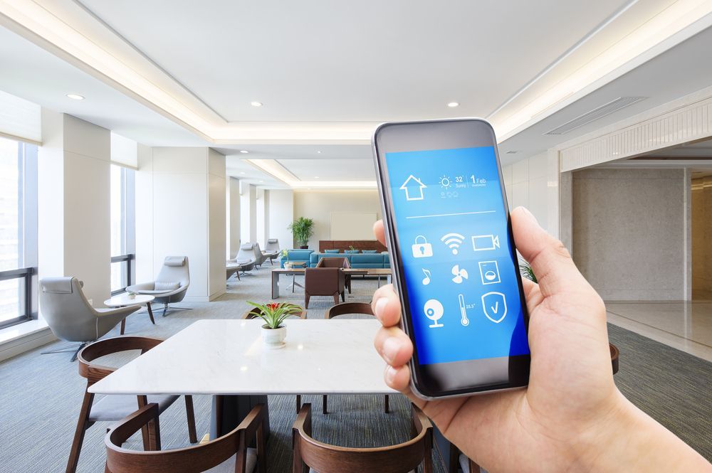 Hand Holding a Smartphone with A Smart Home Control Interface — DevicePro - Phone & Tablet Specialist In Cannonvale, QLD