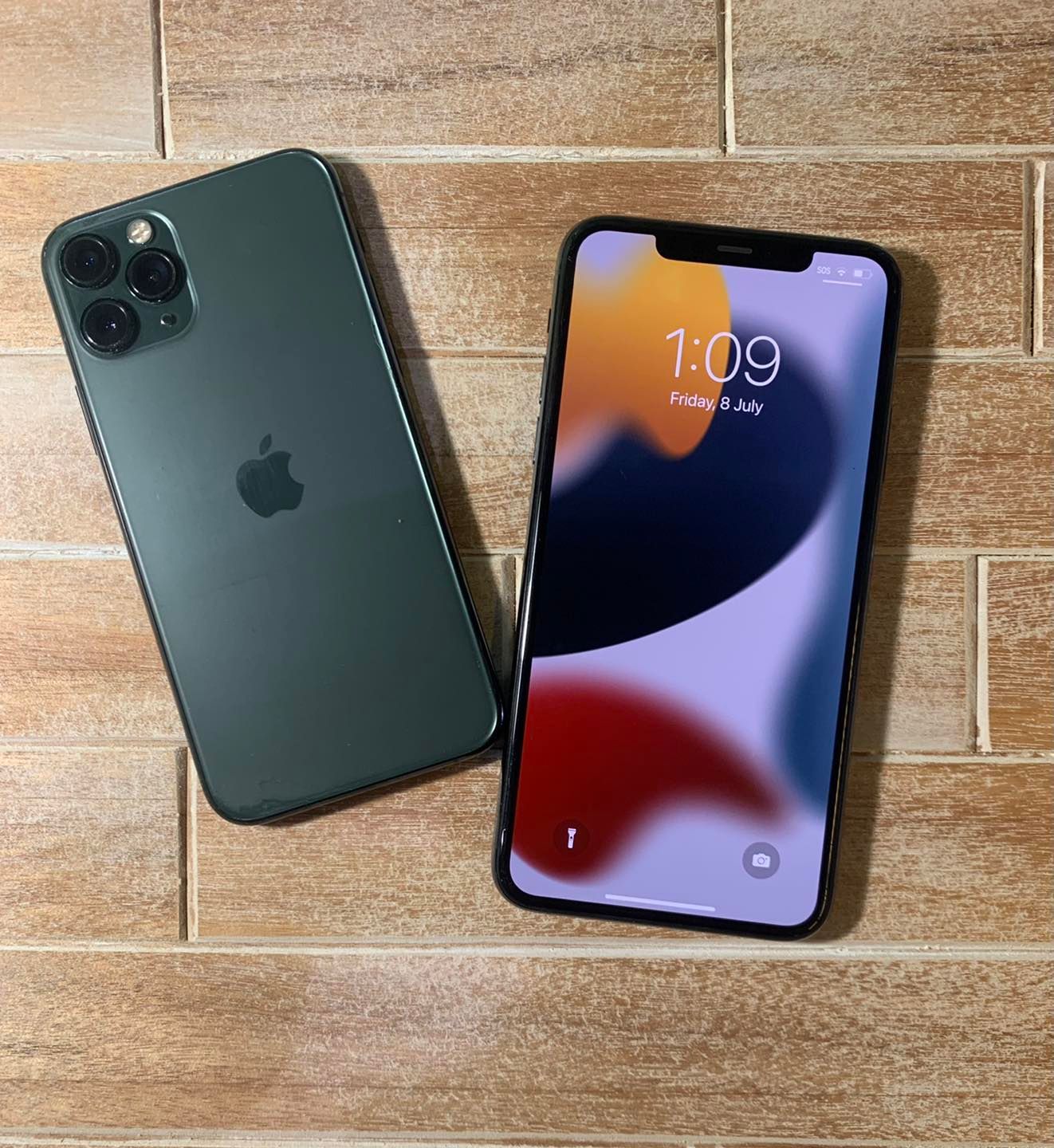 Two I Phones on A Tiled Surface — DevicePro - Phone & Tablet Specialist In Cannonvale, QLD