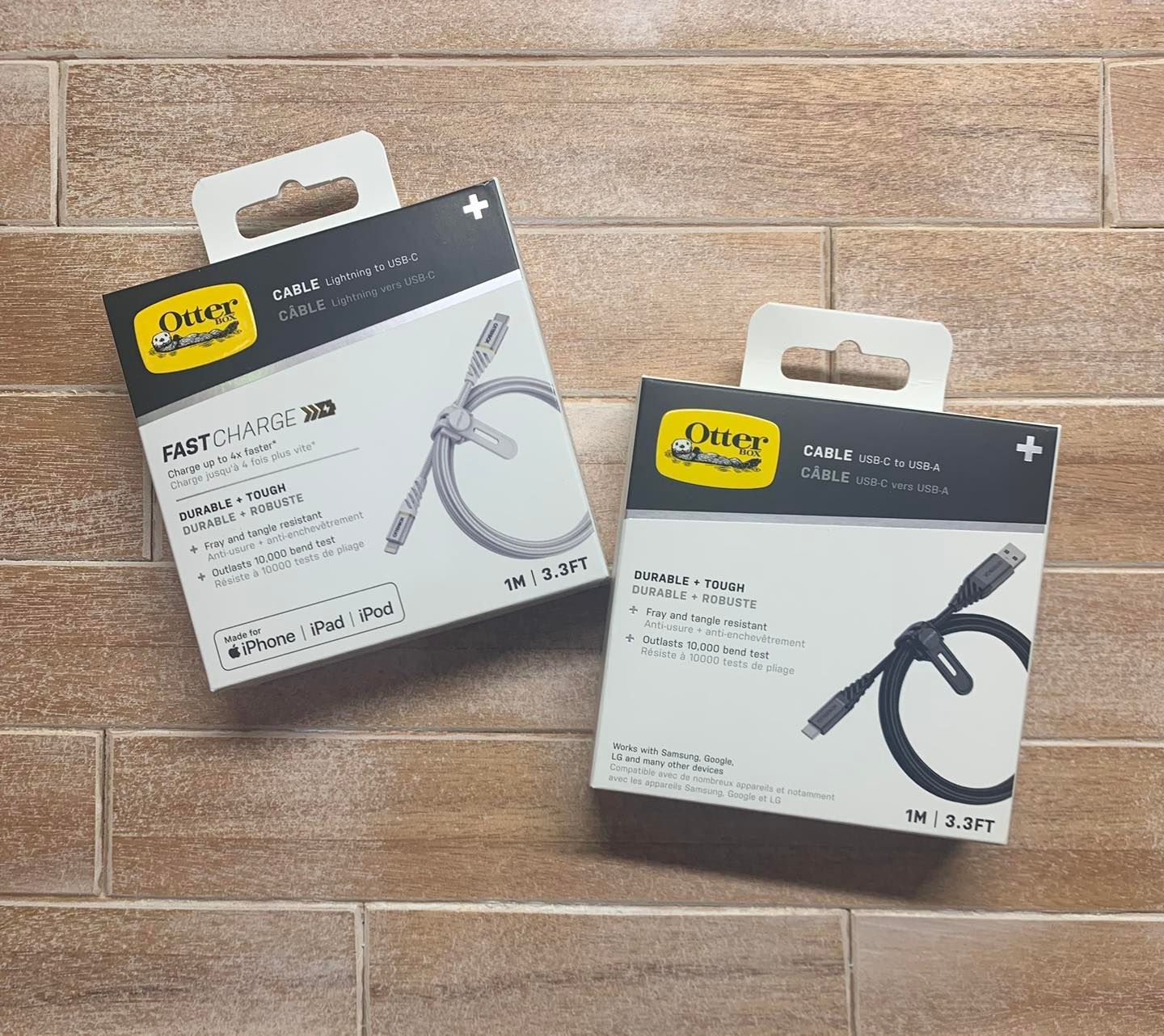 Two Otter Box Usb Cables in Boxes, on A Wooden Surface — DevicePro - Phone & Tablet Specialist In Cannonvale, QLD