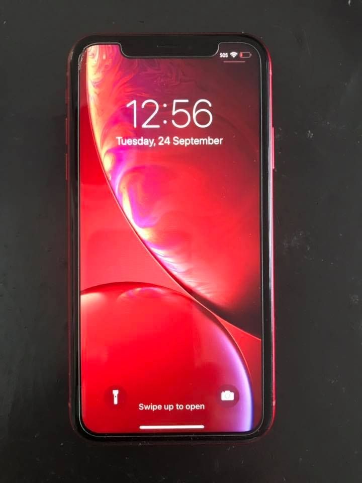 Red IPhone with Lock Screen Displaying the Time — DevicePro - Phone & Tablet Specialist In Proserpine, QLD