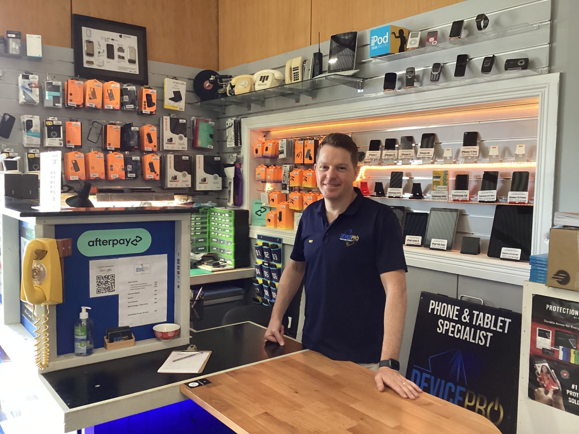 Wooden Stamp on Paper Next to A Disassembled Phone — DevicePro - Phone & Tablet Specialist In Cannonvale, QLD