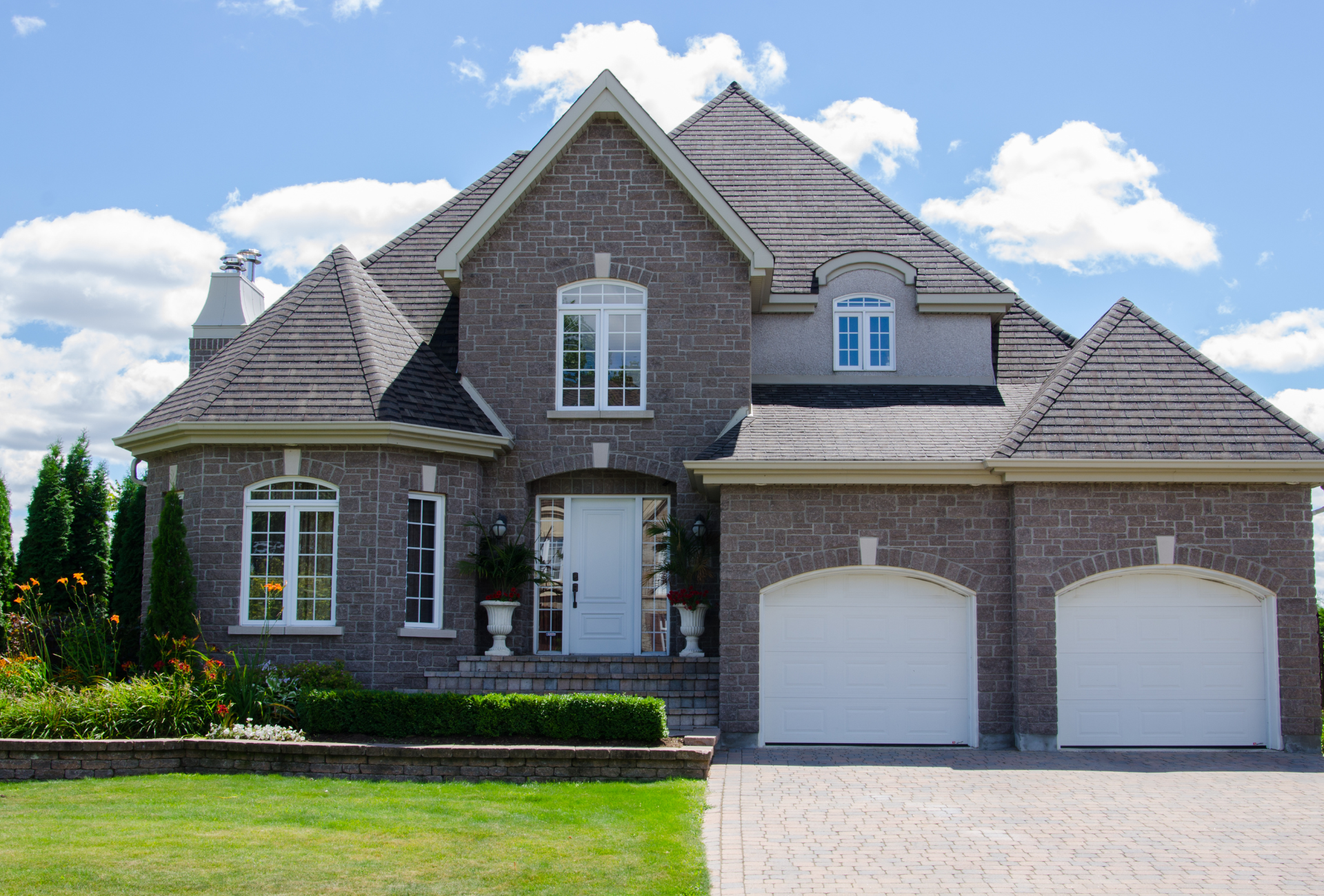 A conference room with tables and chairs and a whiteboard on the wall.