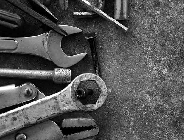 A black and white photo of a bunch of tools on a table.