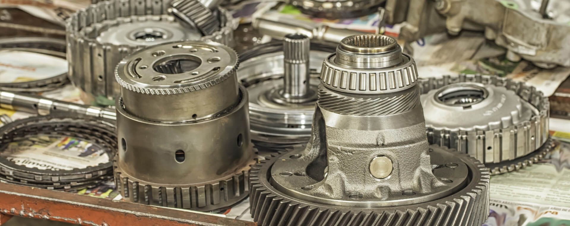 A bunch of gears are sitting on top of each other on a table.