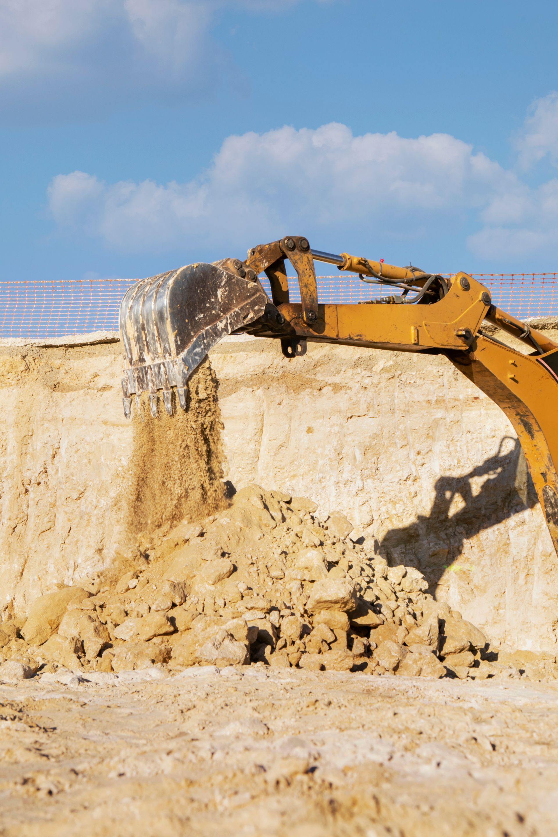 A bulldozer is digging a hole in the ground.