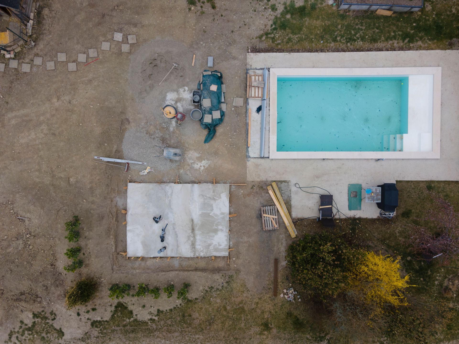 An aerial view of a swimming pool under construction