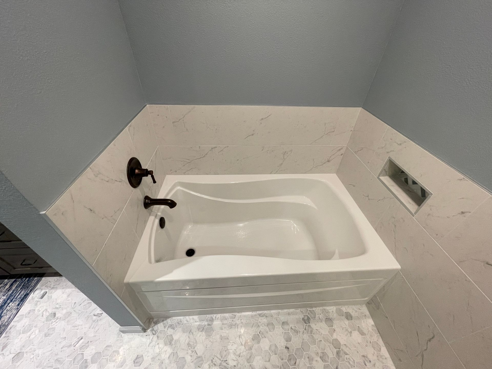 Tulsa Bathroom remodel spa shower stained glass mosaic tile inset marble floor gothic black granite counter