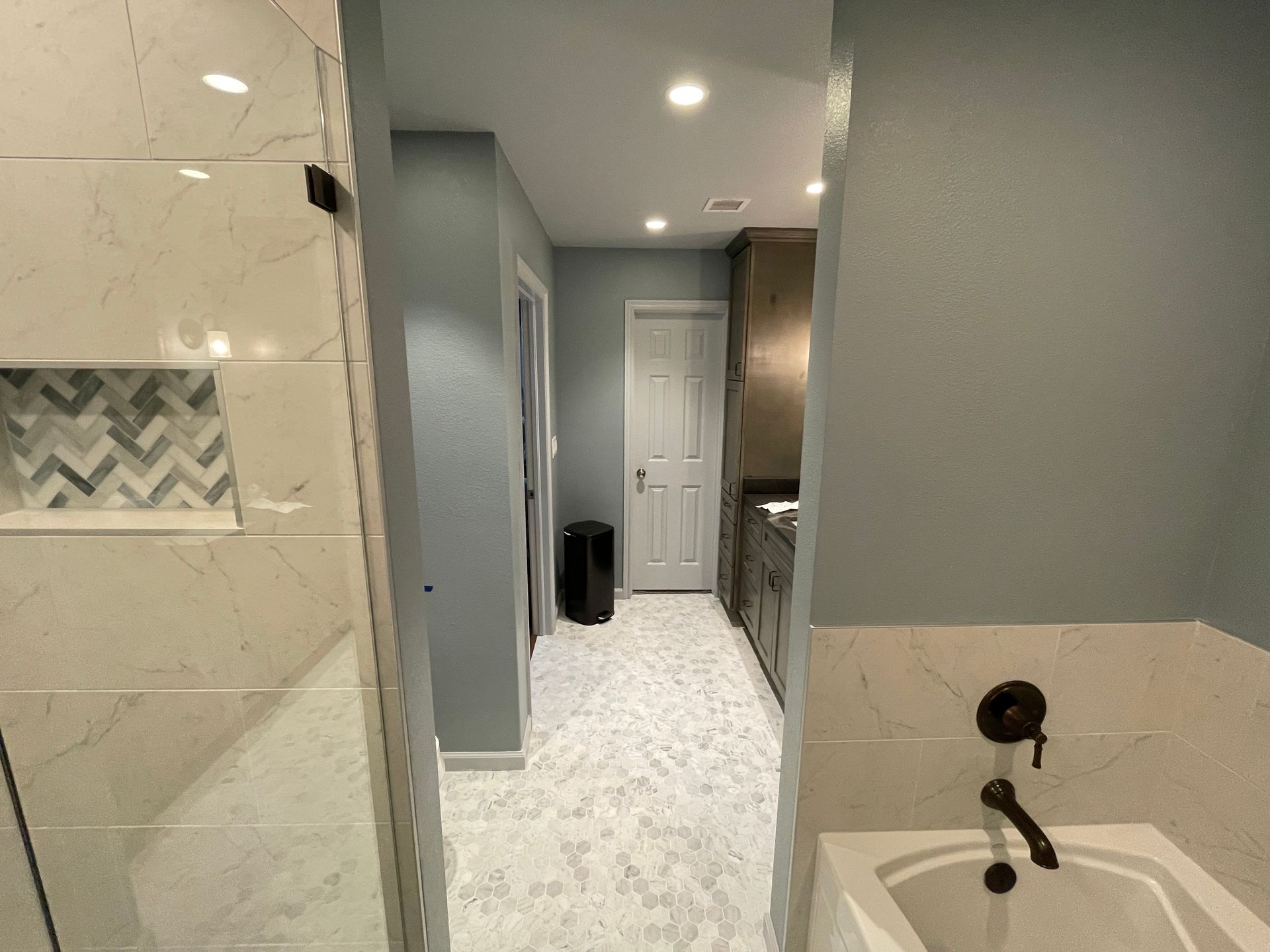 Tulsa Bathroom remodel spa shower stained glass mosaic tile inset marble floor gothic black granite counter